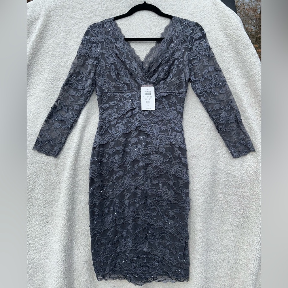 New with tags. Formal dress. Gray/Silver with petit beading, sequins, and lace.